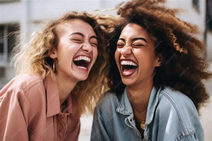 two friends laughing outside